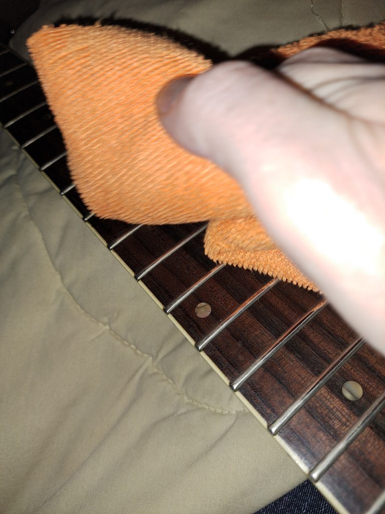 cleaning the fretboard