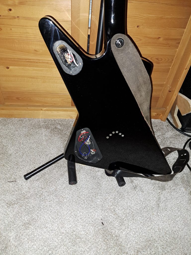back panels removed showing guts of guitar